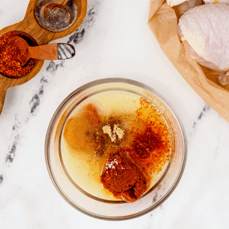 Blended Valentina hot sauce in a blender with garlic, vinegar, water, and salt, smooth and ready to adjust consistency and seasoning."