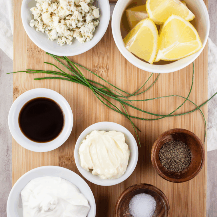 Ingredients needed for Ruth’s Chris Steak House Bleu Cheese Dressing Recipe on kitchen table.