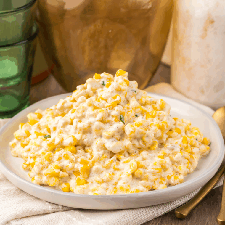 Slow Cooker Ruth’s Chris Creamed Corn—creamy, buttery corn served warm in a white bowl.
