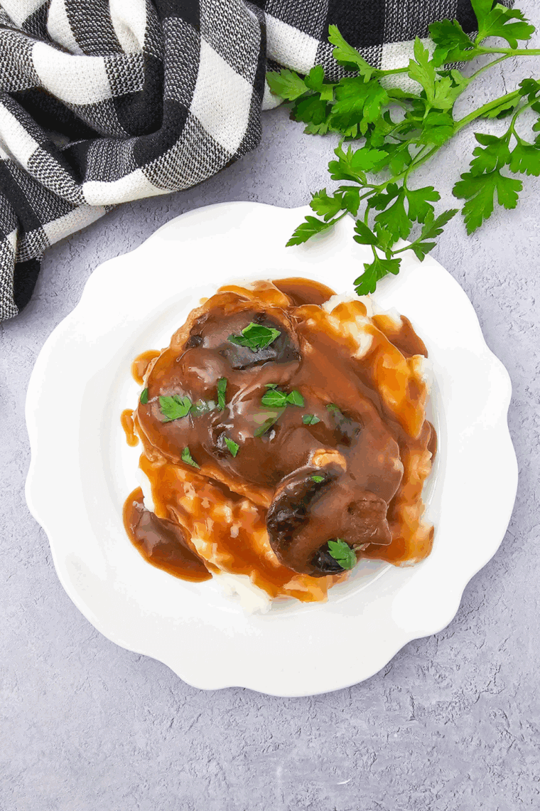 Texas Roadhouse Brown Gravy on top of steak.