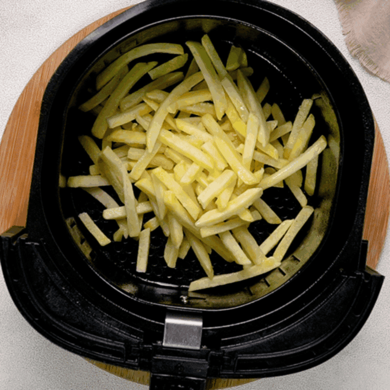 Place french fries in the air fryer basket.