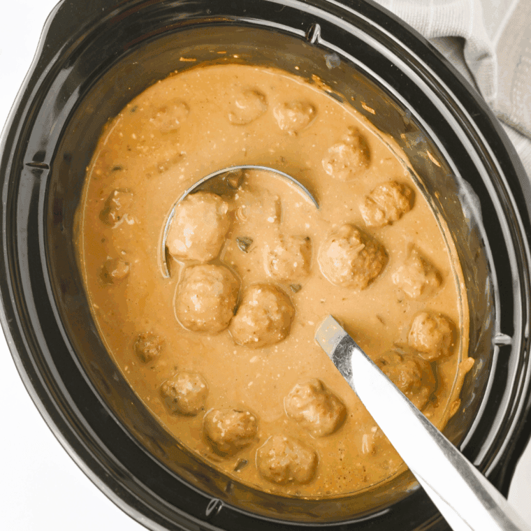 Crockpot Swedish meatballs in a creamy sauce, served in a bowl ready to enjoy.