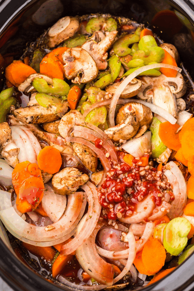 Chicken merlot cooking low and slow in a covered slow cooker