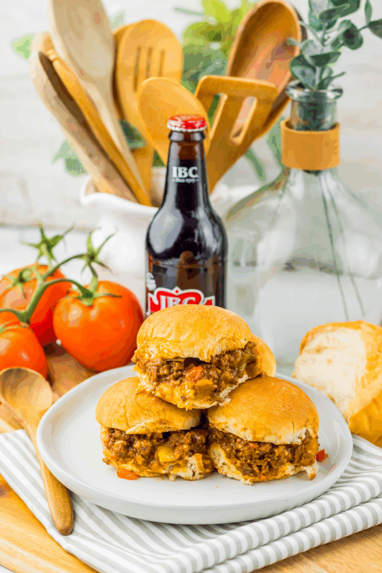 Mini Slow Cooker Root Beer Sloppy Joe Sliders on buns with juicy, saucy beef filling, ready to serve.