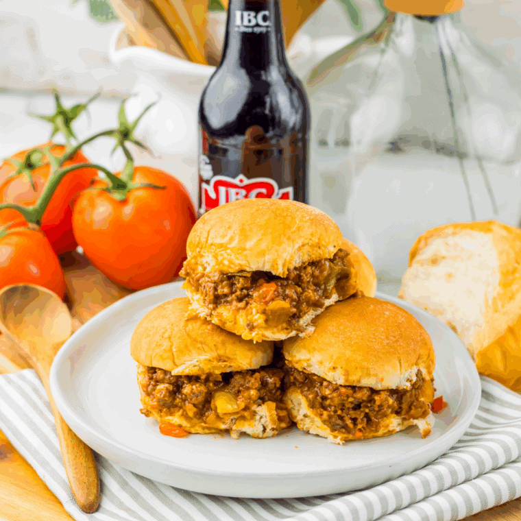 Mini Slow Cooker Root Beer Sloppy Joe Sliders on slider buns with juicy, saucy beef filling, ready to serve.