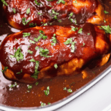 Slow Cooker Sweet Baby Ray’s Chicken cooked until tender and coated in thick, glossy barbecue sauce.