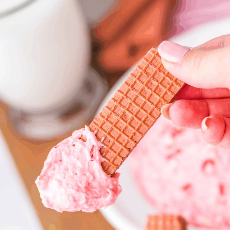 Valentine’s Day Fluff dessert with whipped topping, pink colors, and festive Valentine sprinkles in a serving bowl