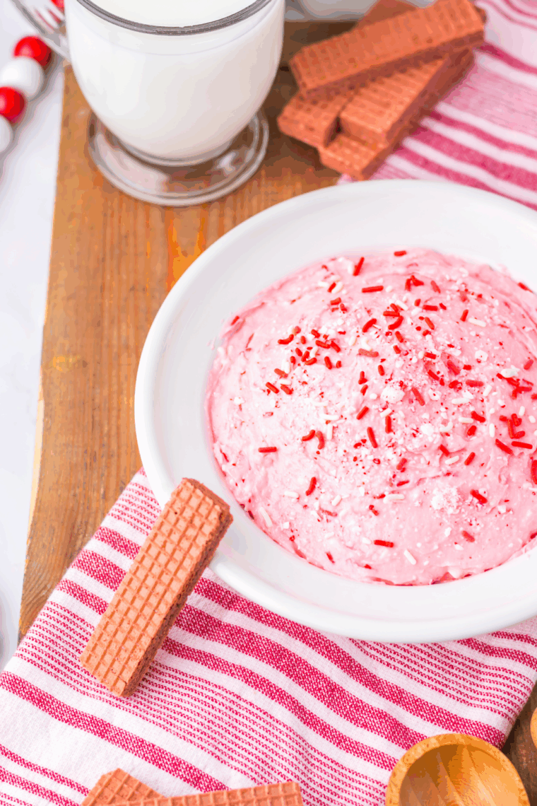 Valentine’s Day Fluff dessert in a bowl with pink tones, whipped topping, and festive Valentine sprinkles