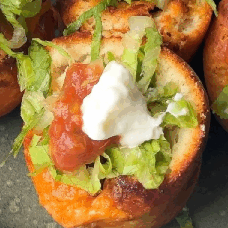 Golden air fryer taco bites filled with seasoned meat, cheese, and toppings