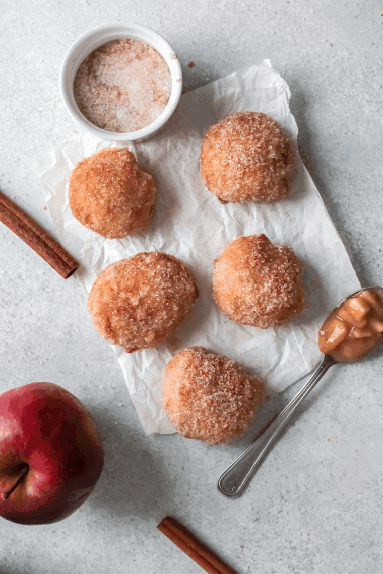 Freshly baked copycat First Watch Holey Donuts on a cooling rack, golden brown and fluffy.
