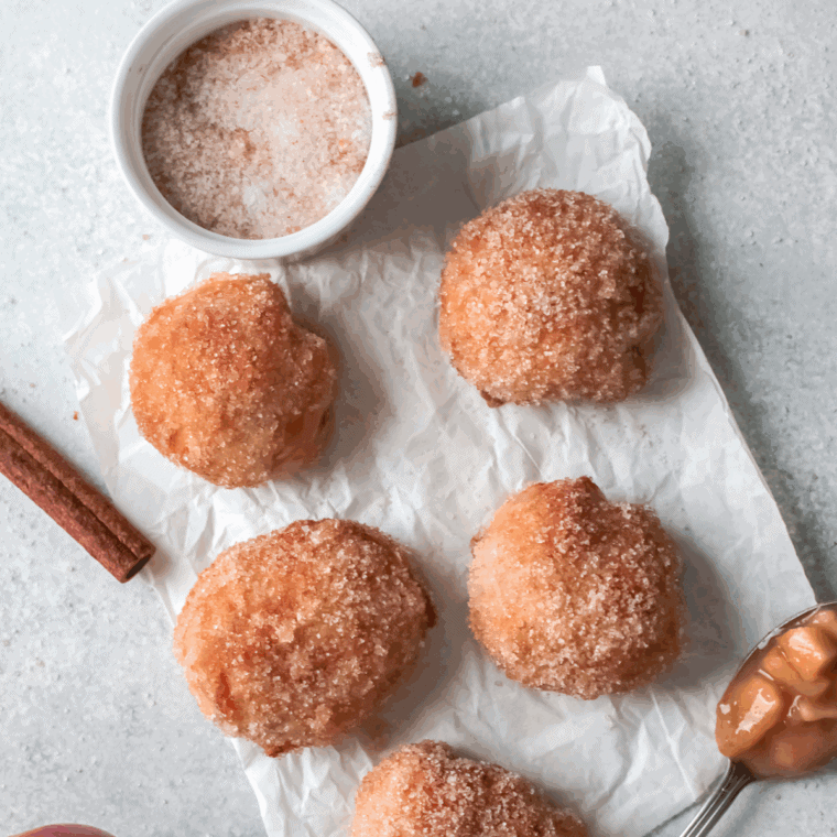 A plate of golden, fluffy homemade First Watch-style holey donuts ready to serve.
