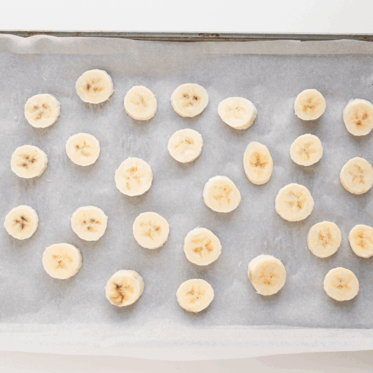 Slice bananas into ½-inch rounds and arrange in a single layer on the sheet.