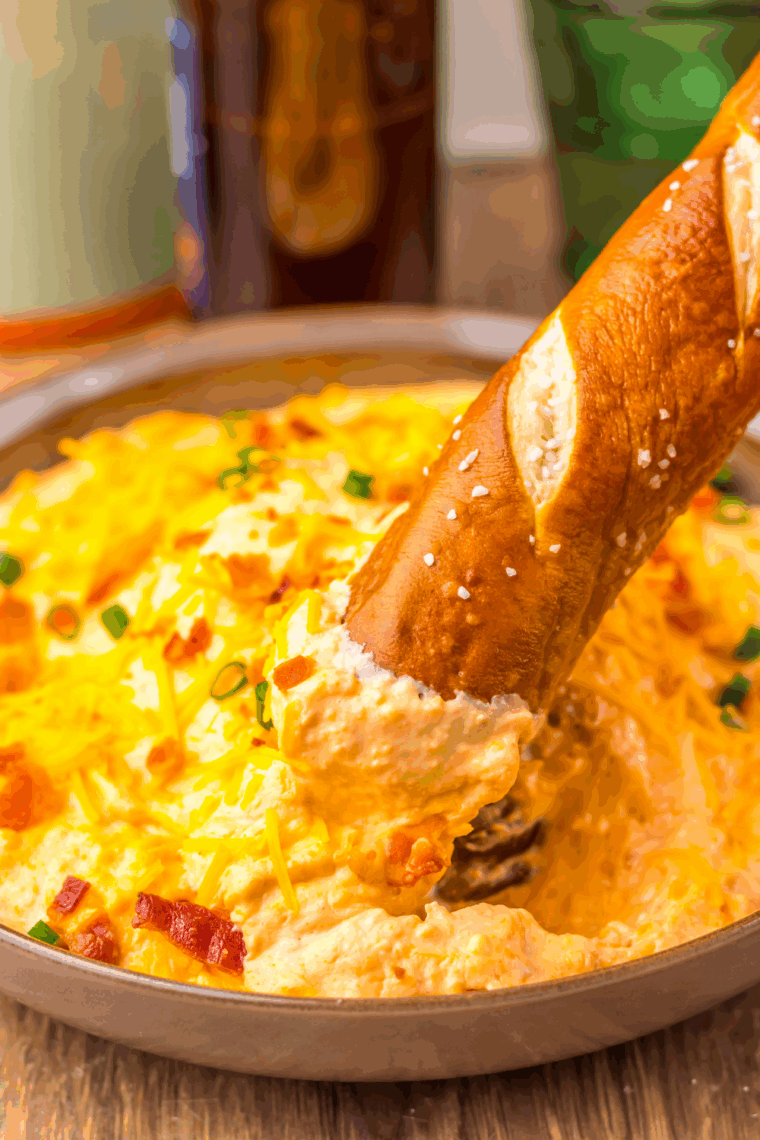 Easy Slow Cooker Beer Cheese Dip made with melted cheese and beer in a crockpo