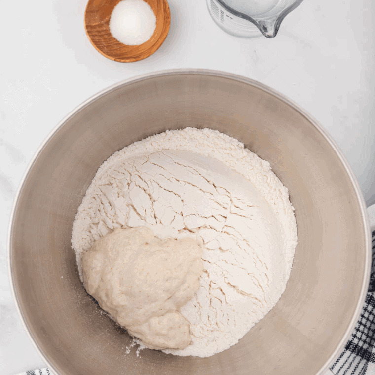 Spraying donut molds with non-stick cooking spray