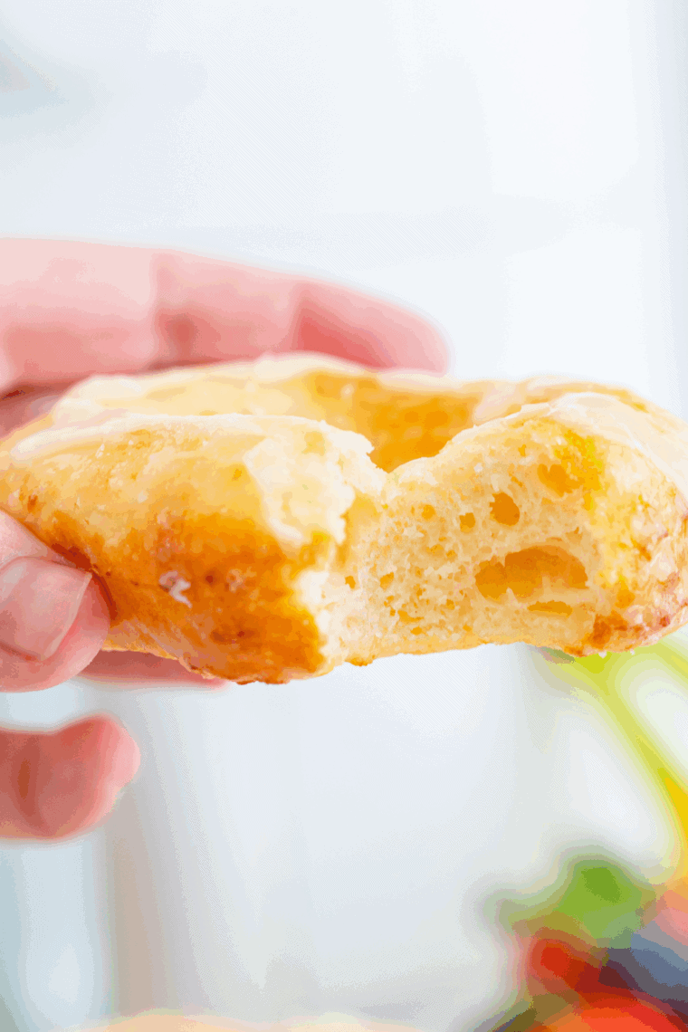 Golden air fryer sourdough discard donuts on a plate with glaze