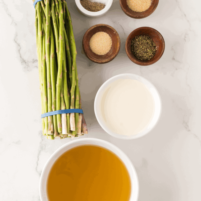 Ingredients needed for Ninja Foodi Cream of Asparagus Soup on kitchen table.