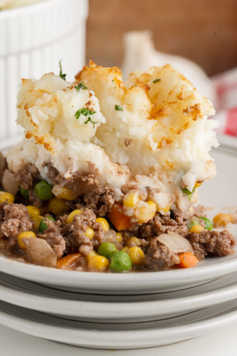 Bowl of easy air fryer shepherd’s pie with ground beef, vegetables, and golden mashed potato topping