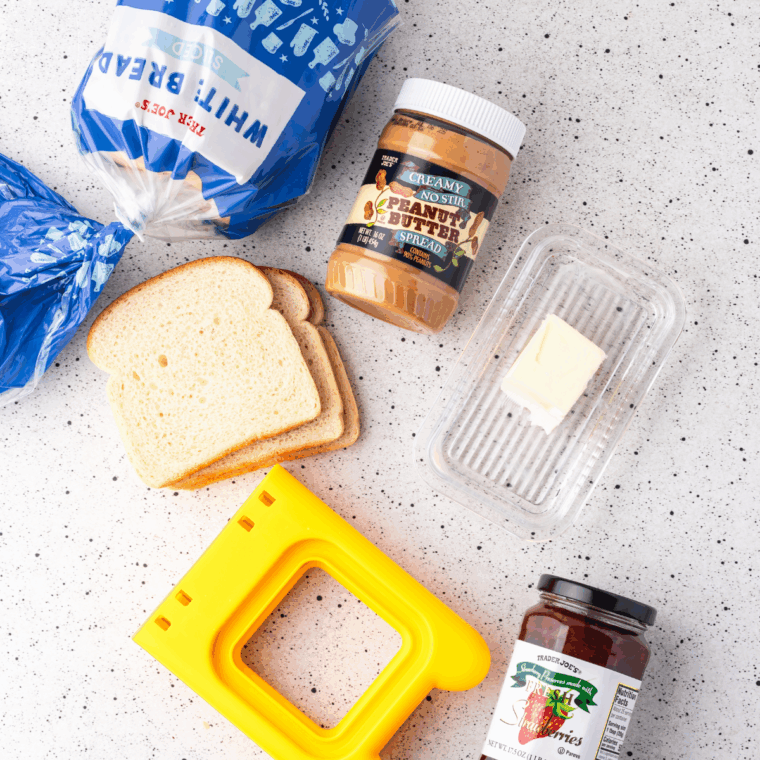 Ingredients needed for Easy Air Fryer DIY Frozen Uncrustables on kitchen table.