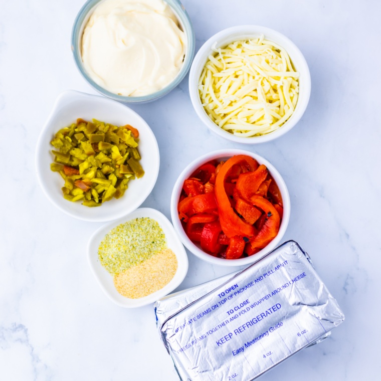 Ingredients needed for Easy Cream Cheese Pepper Dip on kitchen table.