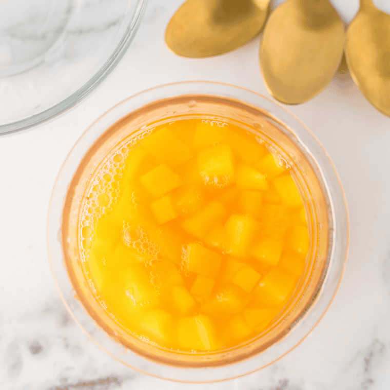 Ingredients needed for Easy Ninja Creami Mango Gelato on kitchen table.