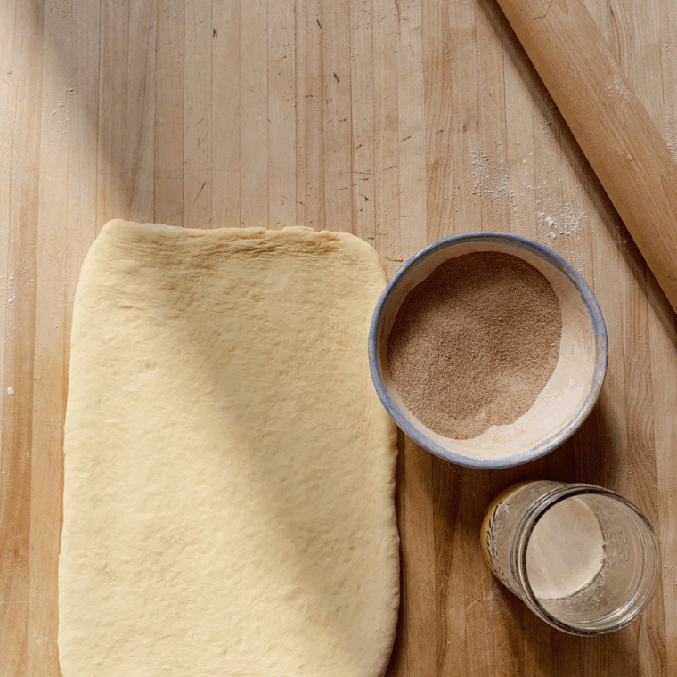 Ingredients needed for Easy Puff Pastry Cinnamon Twists on kitchen table.