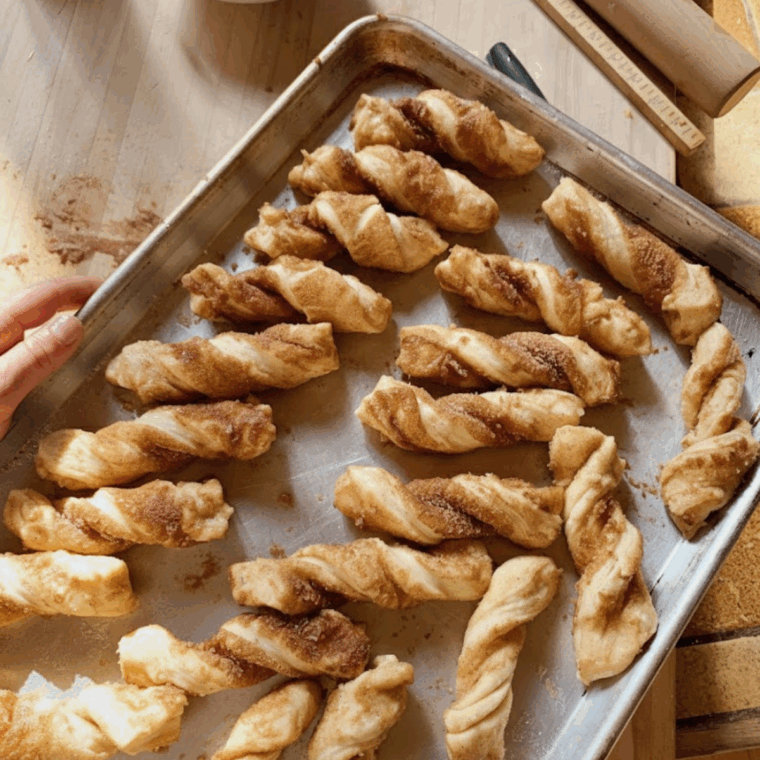 Easy puff pastry cinnamon twists baked golden and dusted with sugar