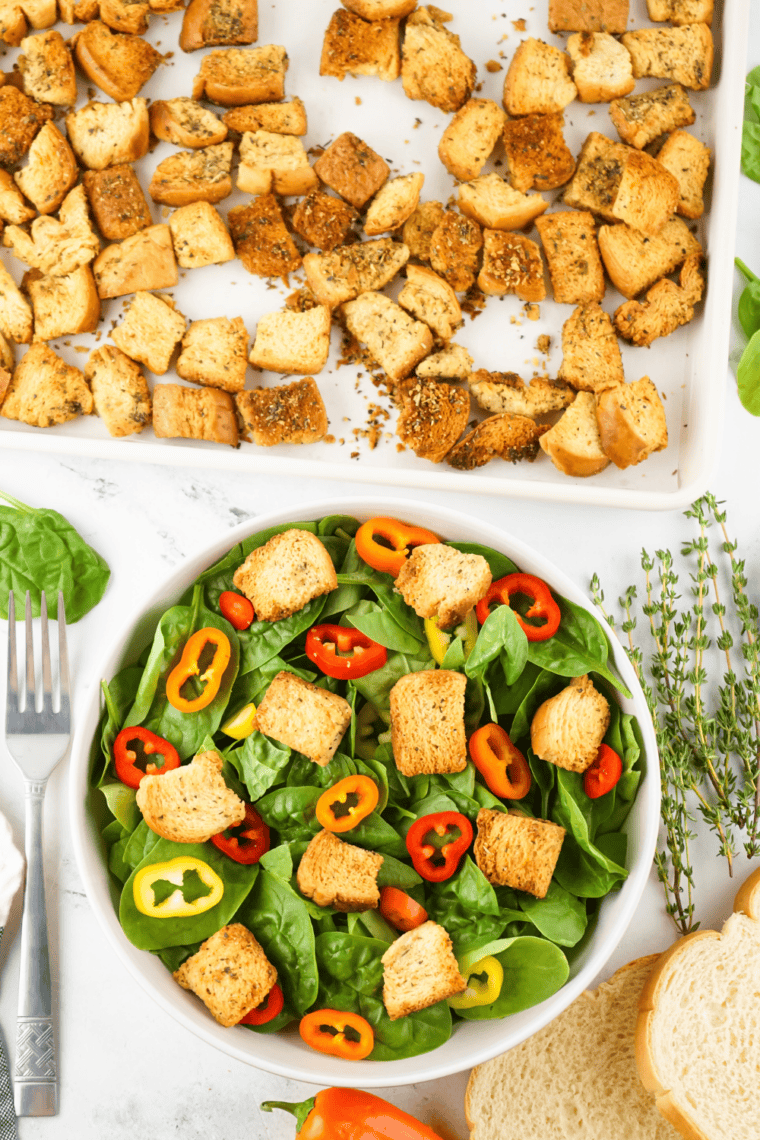 Copycat Bonefish House Salad with fresh lettuce, cherry tomatoes, and signature dressing served in a white bowl.