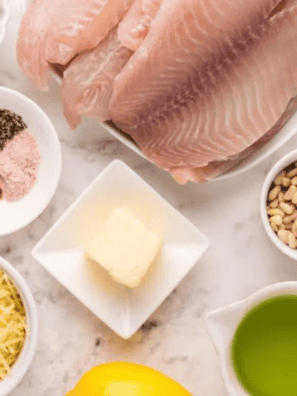 Homemade copycat Kinder’s honey mustard seasoning blend in a small bowl with spices on a wooden surface.