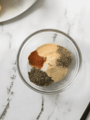 Bowl of homemade Kinder’s The Steak Blend seasoning ready to use