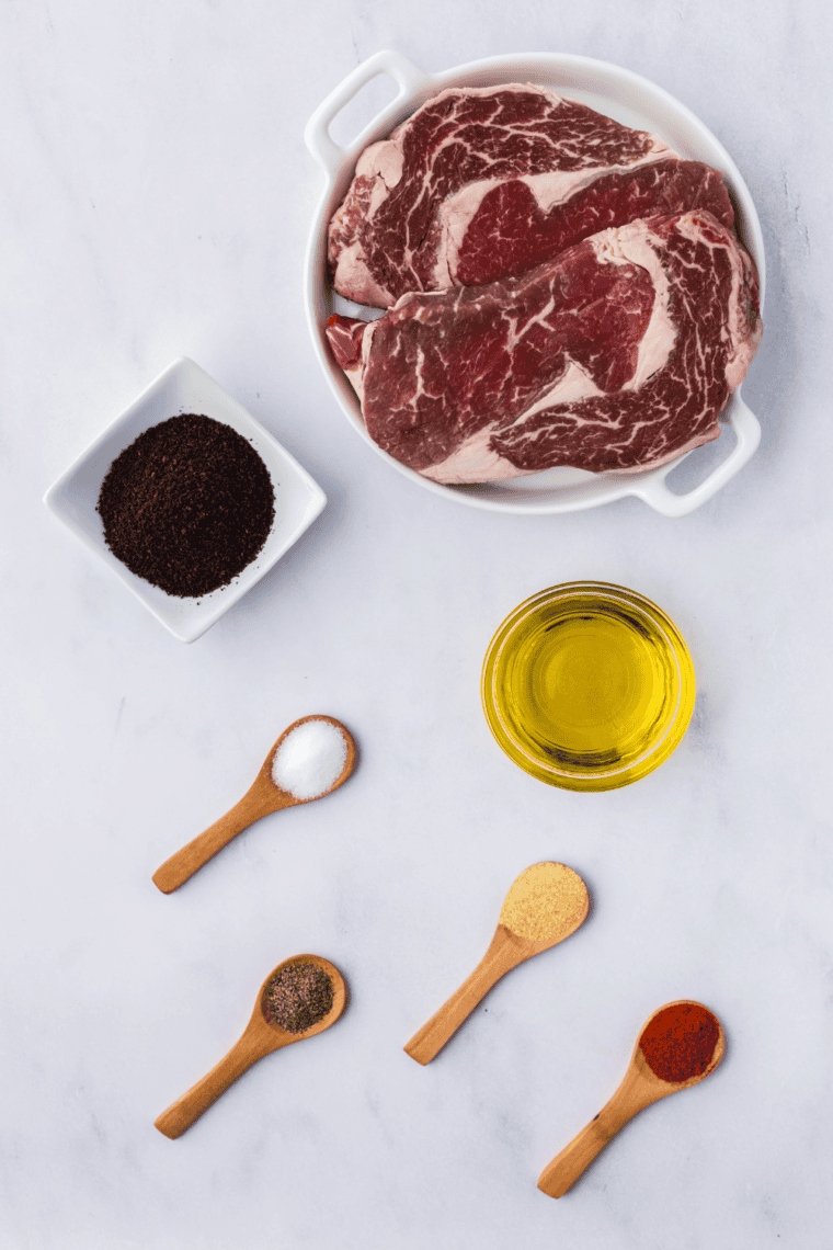 Ingredients for copycat McCormick Montreal steak seasoning laid out on a table.