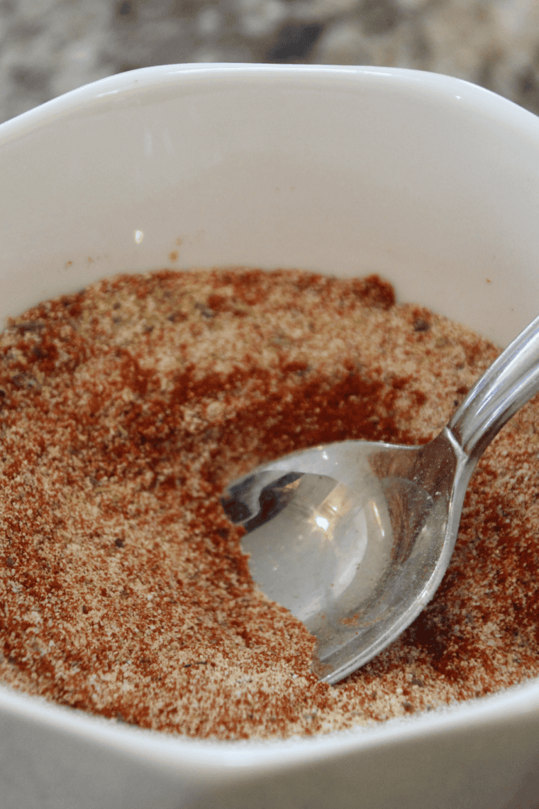 Tasting and adjusting homemade Montreal steak seasoning.