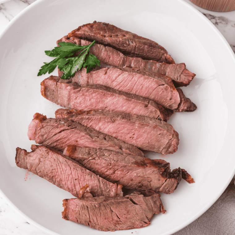 Copycat McCormick Montreal steak seasoning in a small bowl with coarse pepper and spices.