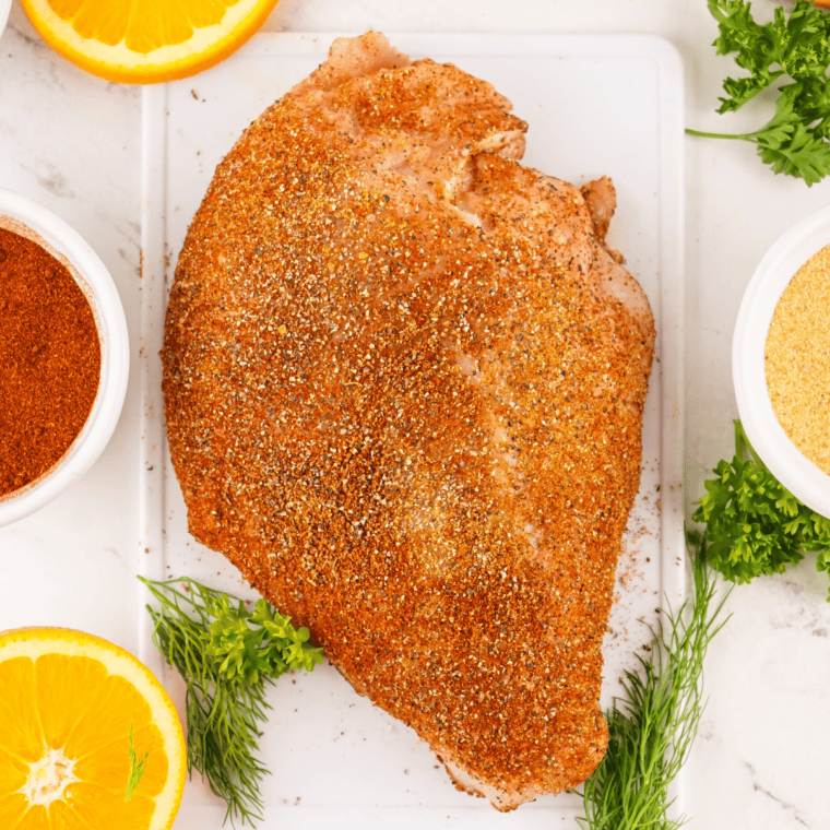 Sprinkling Copycat Tony Chachere’s Creole Seasoning on meats, seafood, and vegetables.