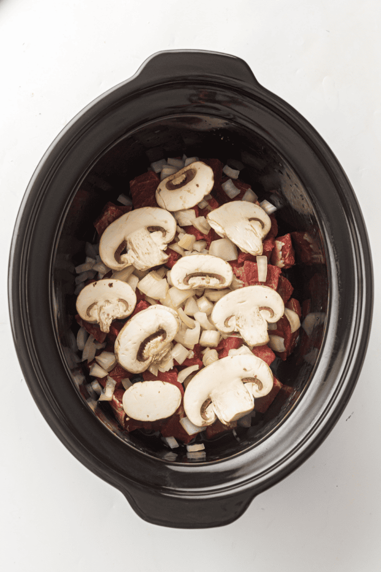 Mixing dried spices in bowl for beef stroganoff sauce mix.