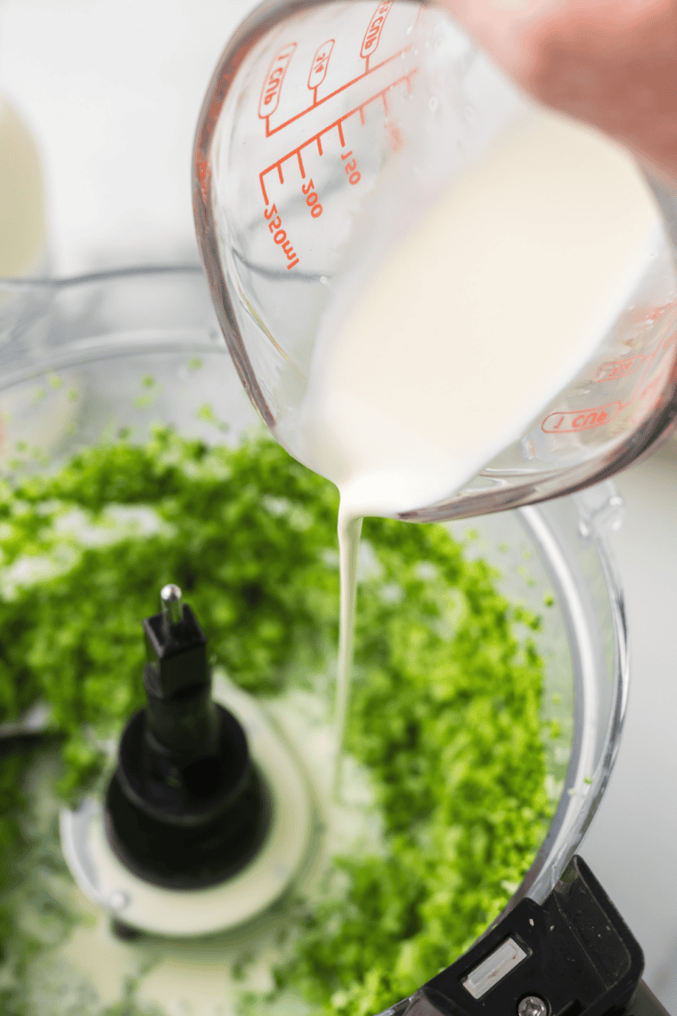 Sautéing chopped garlic in olive oil and butter, adding broccoli cream mixture, seasoning with salt, pepper, and garlic powder.