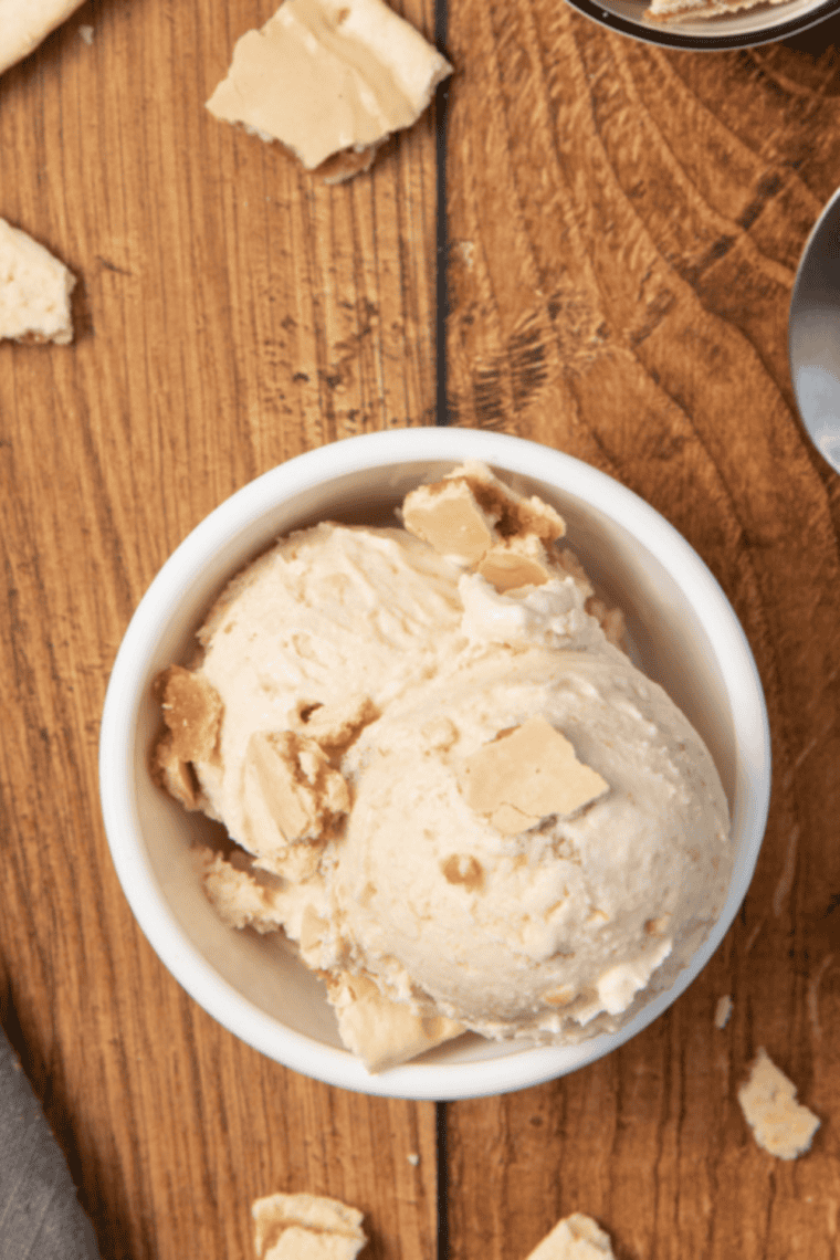 Bowl of creamy almond gelato made in the Ninja Creami, garnished with almonds