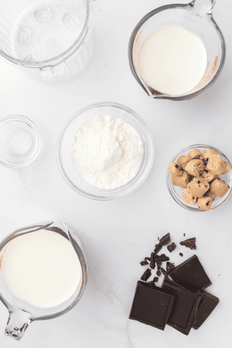 Ingredients needed for Ninja Creami Copycat Baskin Robbins Mom's Makin Cookies Recipe on kitchen table.