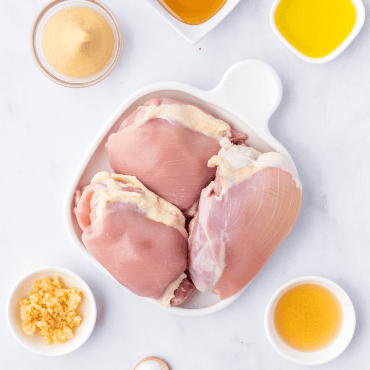 Ingredients needed for Ninja Foodi Grill Boneless Chicken Thighs on kitchen table.