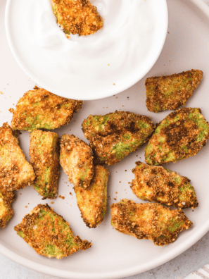 golden, crispy air fryer avocado chips served on a plate for a healthy snack