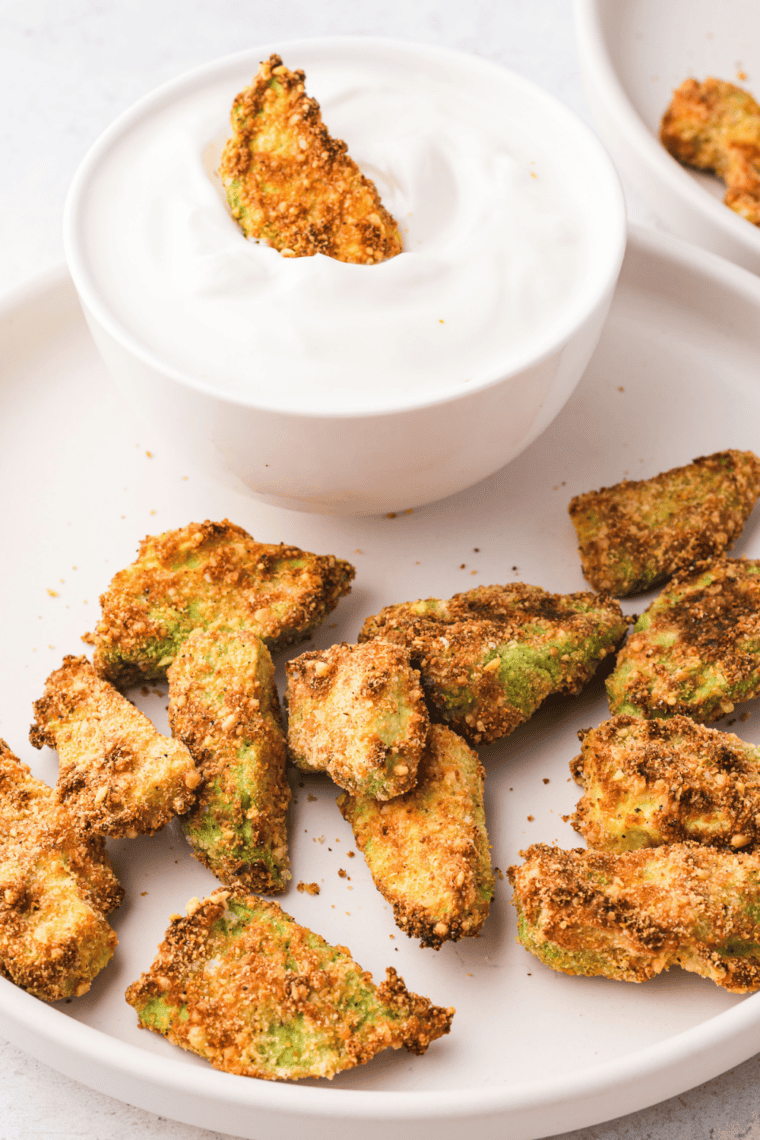 crispy golden air fryer avocado chips served on a plate for a healthy snack