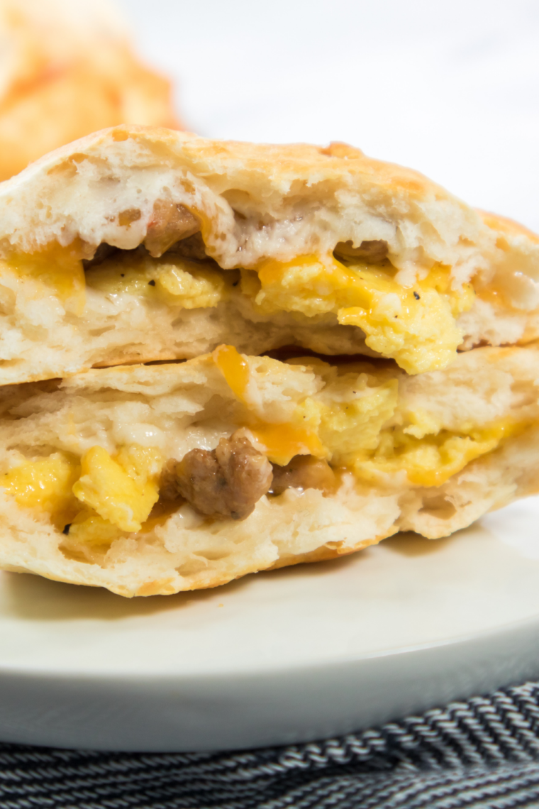 homemade breakfast biscuit sandwich bacon sausage ham egg and cheese stack
