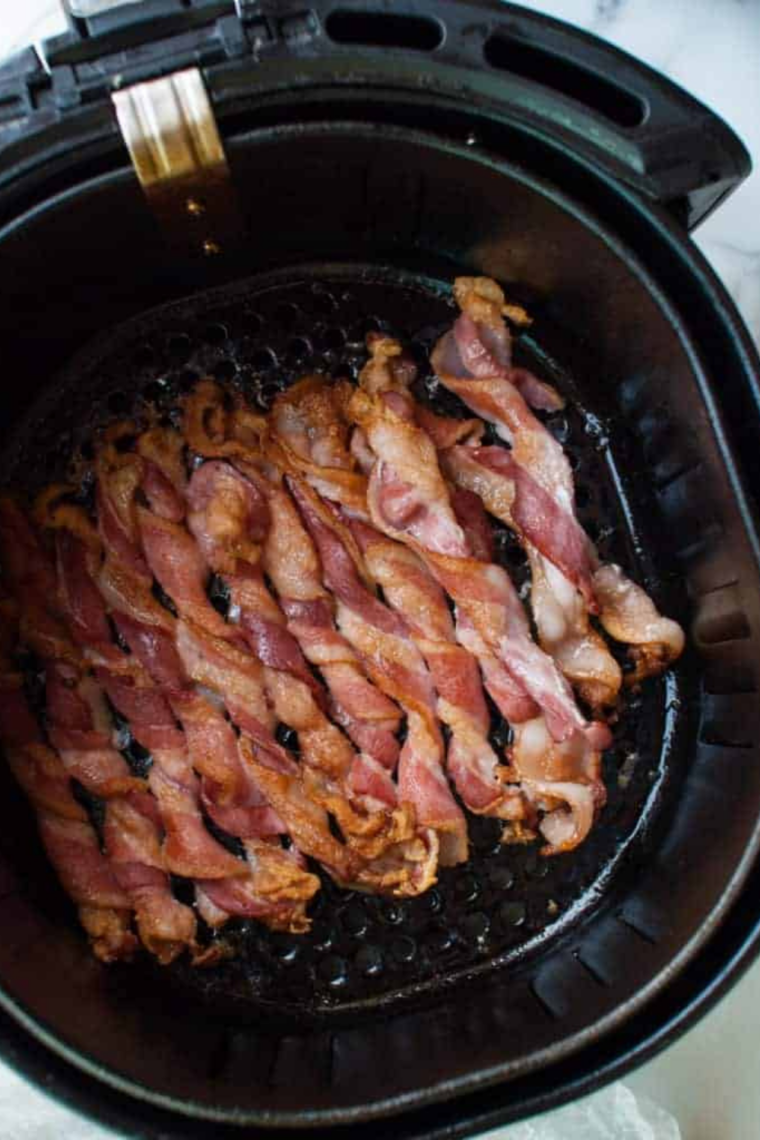Air fryer bacon cooked at 380°F until crisp and golden