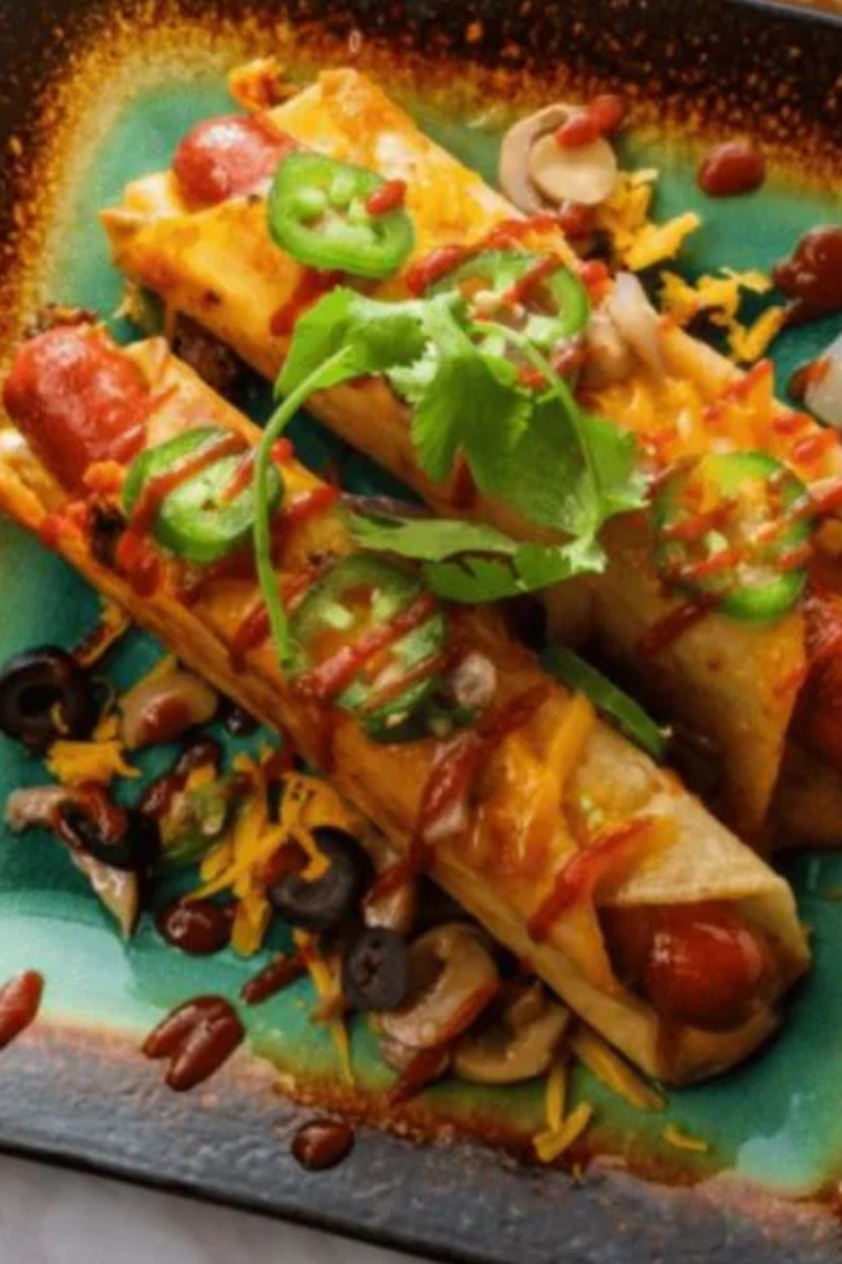 Air fryer hot dog taquitos made with tortillas wrapped around hot dogs, cooked until golden brown, crispy, and cheesy inside.