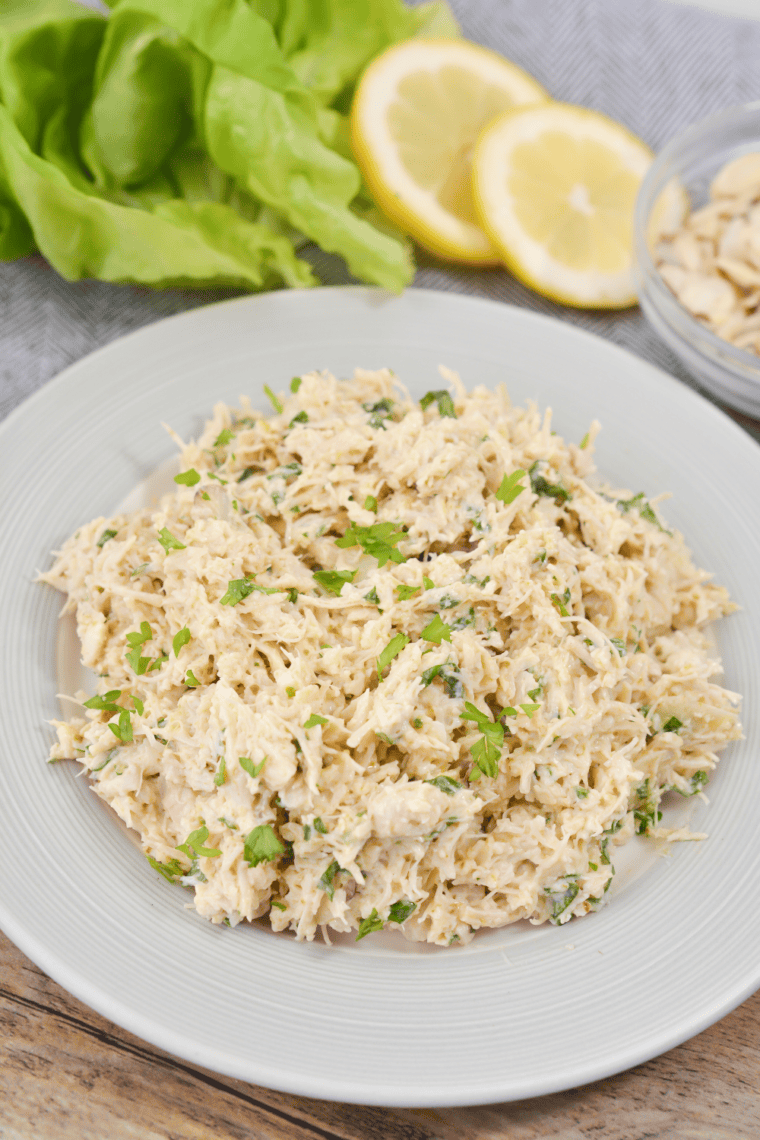 Creamy Chicken Salad Chick Classic Carol copycat recipe made with shredded chicken and mayonnaise served in a bowl.