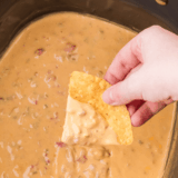 If you need a party dip that disappears faster than you can say “grab a chip,” this is it. This crock pot cream cheese taco dip is ridiculously creamy, loaded with bold taco flavor, and takes almost no effort to throw together.