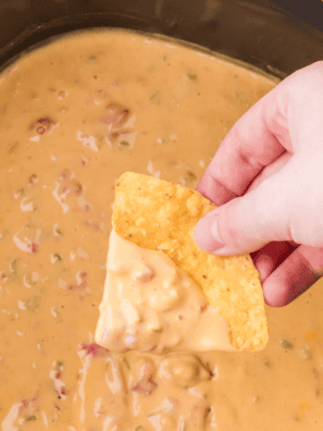 If you need a party dip that disappears faster than you can say “grab a chip,” this is it. This crock pot cream cheese taco dip is ridiculously creamy, loaded with bold taco flavor, and takes almost no effort to throw together.