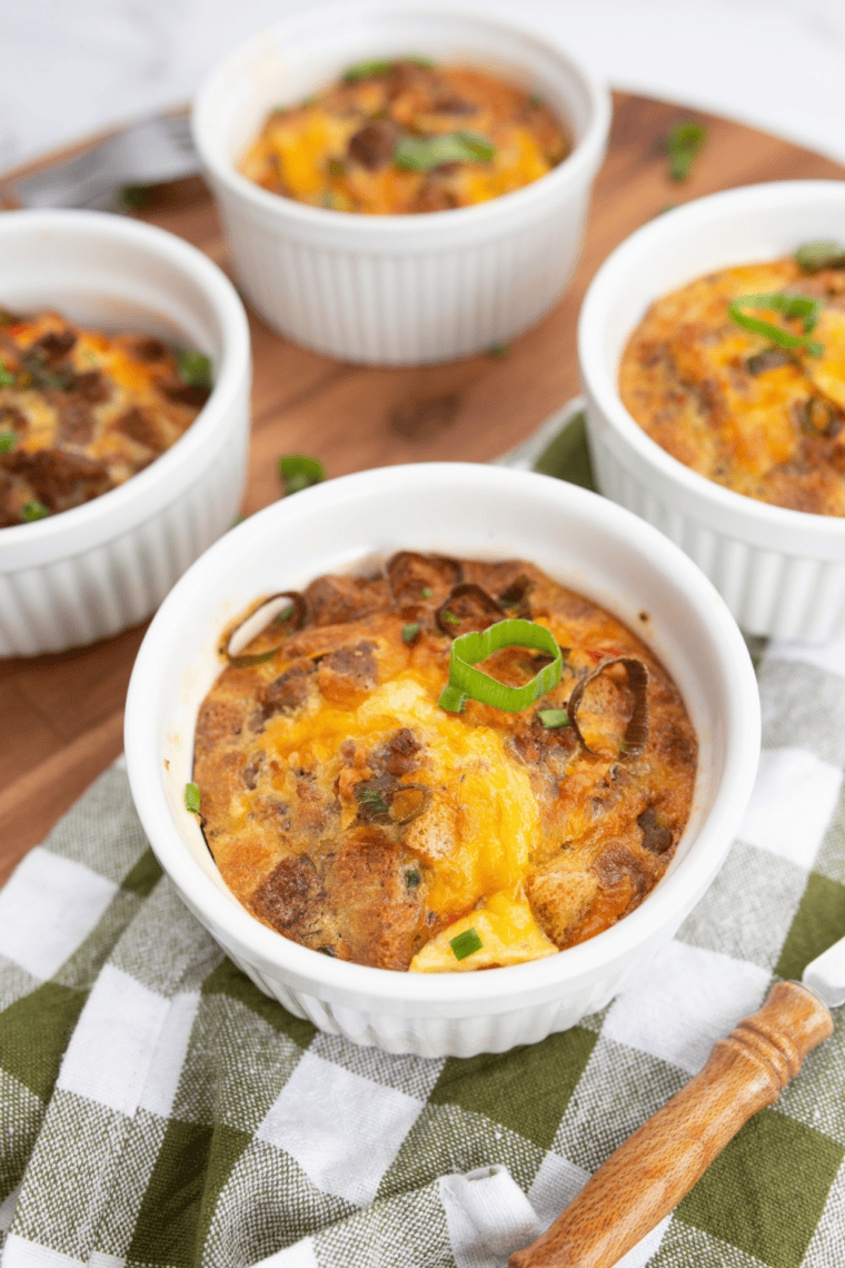 Baked Ina Garten breakfast strata with golden top and layers of bread, eggs, cheese, and savory fillings in a casserole dish.