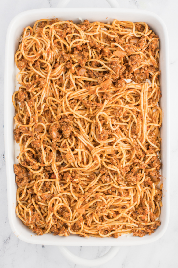 Baked spaghetti casserole inspired by Fazoli’s with layers of pasta, meat sauce, and melted mozzarella cheese baked until golden and bubbly.