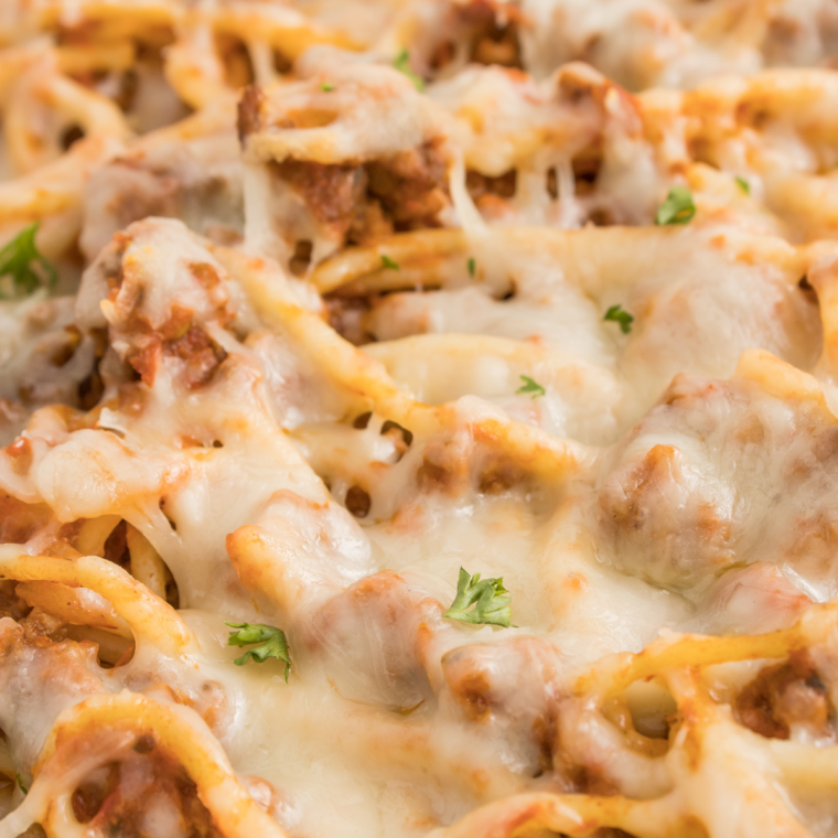 Baked spaghetti casserole inspired by Fazoli’s with layers of spaghetti, meat sauce, and melted mozzarella cheese baked until golden and bubbly.