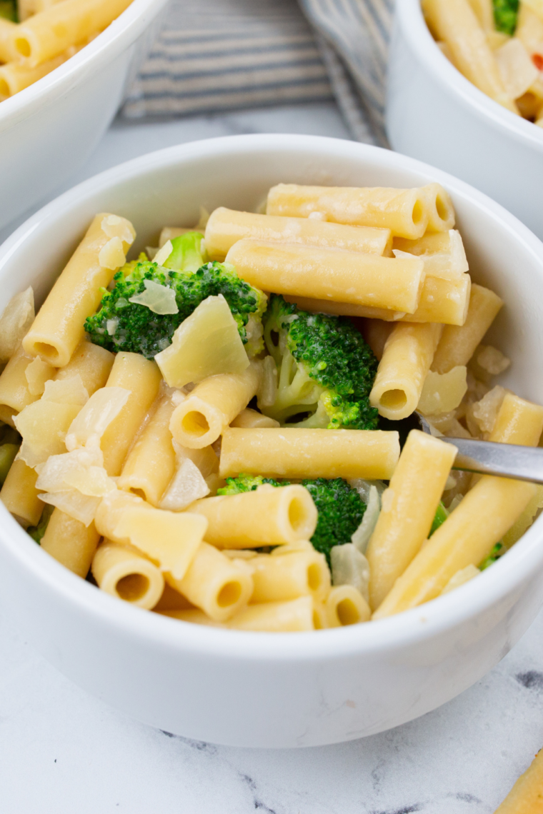 Creamy baked chicken broccoli penne inspired by Fazoli’s with tender chicken, roasted broccoli, Alfredo sauce, and melted cheese on top